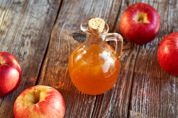 istock A jug of apple cider vinegar with fresh red apples 1364627533