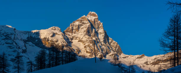 matterhorn im winter, von breuil - larch tree stone landscape sky stock-fotos und bilder