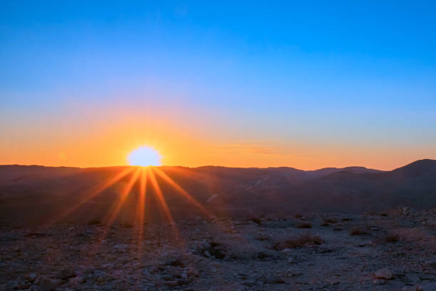 istock colorful sunrise in desert 1364629634