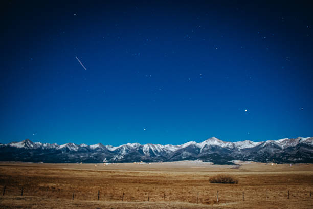 istock Snowy mountains at night 1364635358