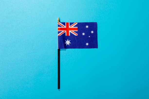istock Overhead view of australia flag isolated on blue background with copy space 1364636068
