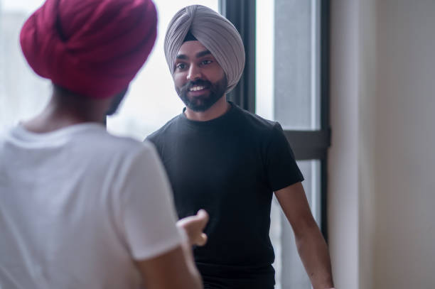 istock Two men in turbans talking and looking involved 1364636174