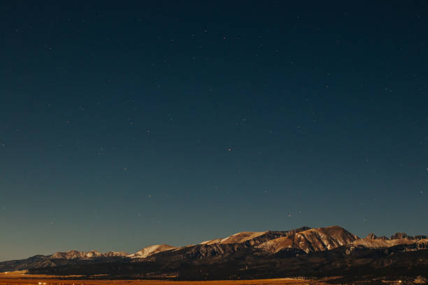 istock Snowy mountains at night 1364636316