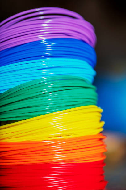 istock Multi-colored plastic for creativity in the colors of the rainbow. Materials for creativity close-up. Skeins of thin plastic are stacked next to each other 1364636472