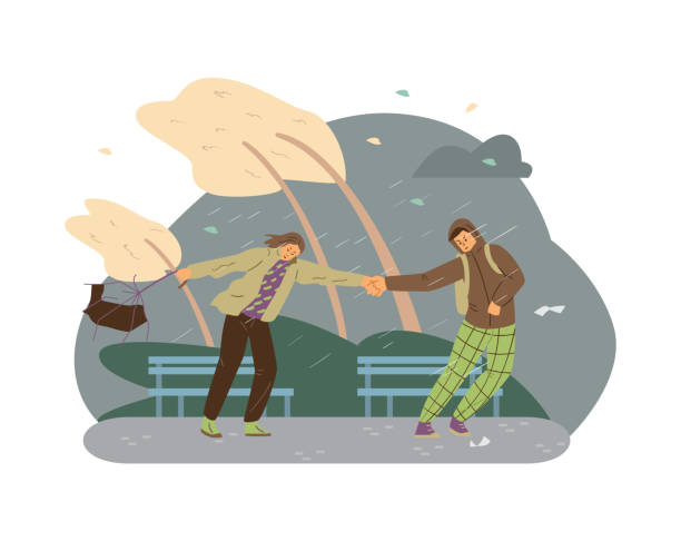 мужчины и женщины испытывают экстремальную ветровую погоду в парке. молодые люди держатся за руки во время сильного шторма и сильного дожд� - breaking wind stock illustrations
