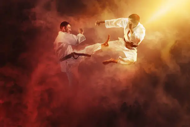 Martial arts masters, karate practice. Two male karate fighting