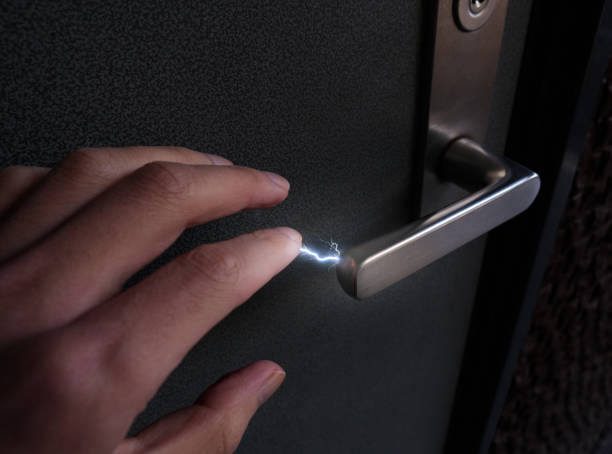 Image of static electricity discharge when touching a lever-type doorknob stock photo