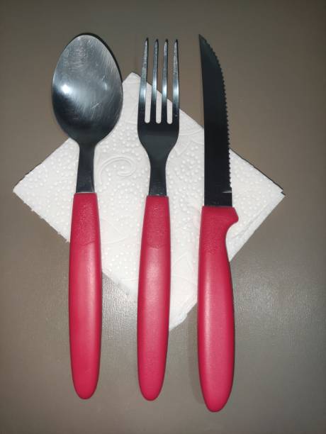 red cutlery on napkin top angle