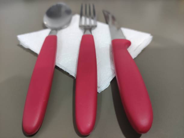 istock red cutlery on napkin low angle 1364639772