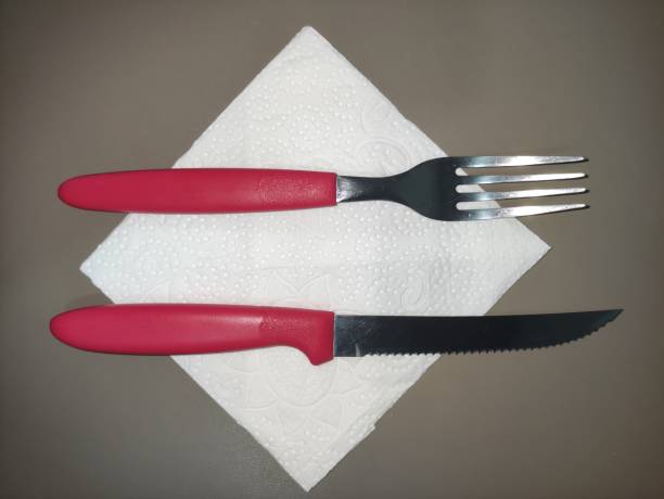 istock red cutlery on napkin top right angle 1364639808