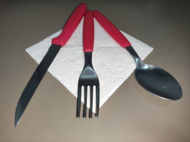 red cutlery on napkin upper angle 2