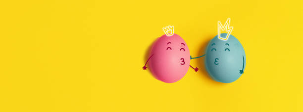 istock Happy Valentine's Day banner. Chicken egg with crowns on yellow background. Top view, flat lay, copy space. 1364640974
