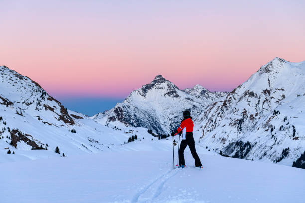 istock Skier in ski-resort Lech after sunset 1364645016