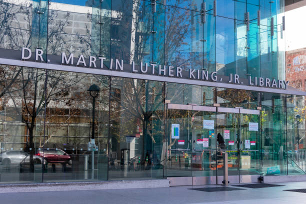 Dr. Martin Luther King JR. Library sign above the entrance to public library and university library Dr. Martin Luther King JR. Library sign above the entrance to public library and university library - San Jose, California, USA - 2021 martin luther king jr day stock pictures, royalty-free photos & images