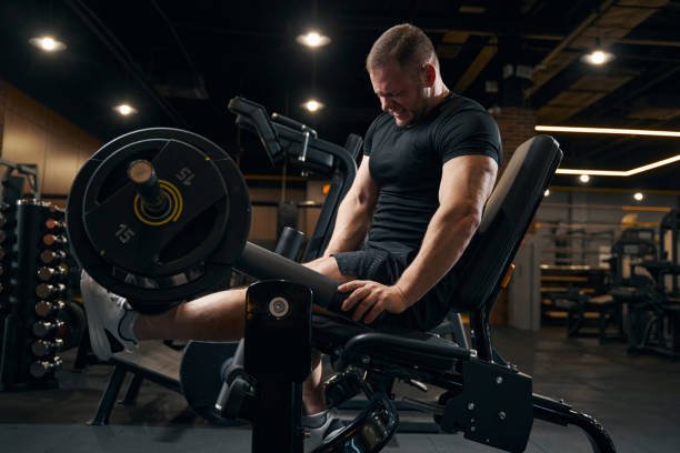 istock Strong weightlifter working out on exercise equipment 1364650338