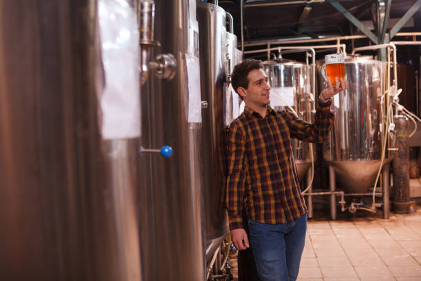 istock Professional beer maker at craft brewery 1364650535