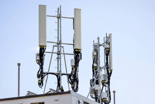 istock Cell towers on rooftop of the building, background with copy space 1364655241