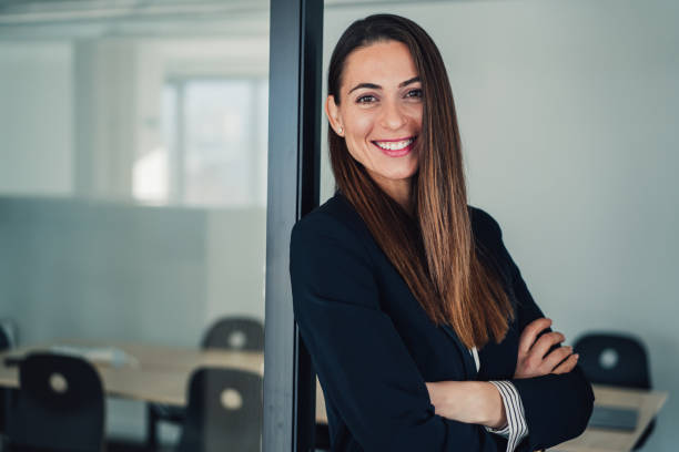 istock Confident businesswoman in modern office. 1364657524