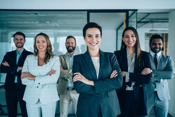 istock Confident businesswoman and her team. 1364657530