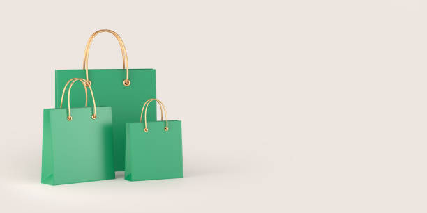 istock Green shopping bags on a beige background 1364657593
