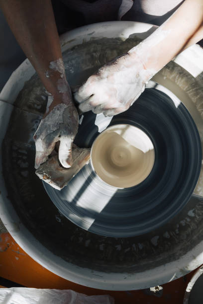 istock Anonymous Woman Potter Working on a Wheel 1364660885