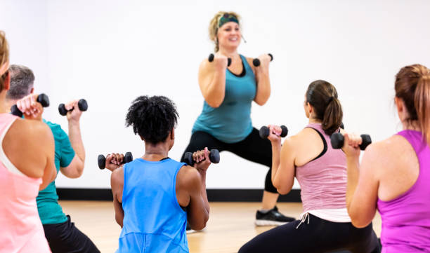 istock Hispanic woman leading aerobics class 1364677402