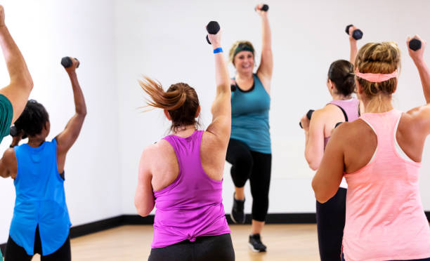 istock Hispanic woman leading aerobics class 1364677431