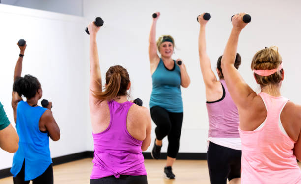 istock Hispanic woman leading aerobics class 1364677434