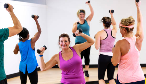 istock Mature woman taking aerobics class 1364677436