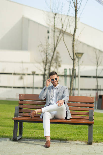 istock Businessman is sitting and smiling 1364680393