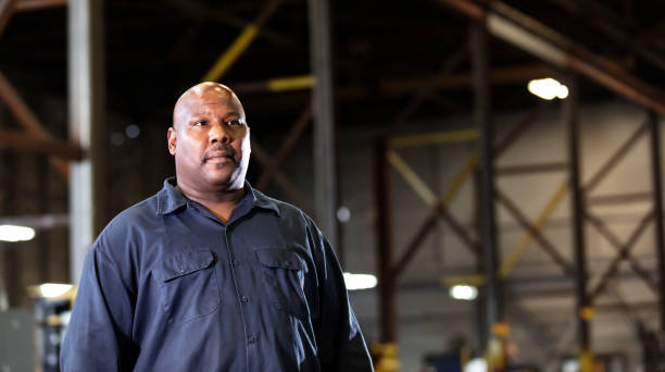 istock African-American man working in dark warehouse 1364681919
