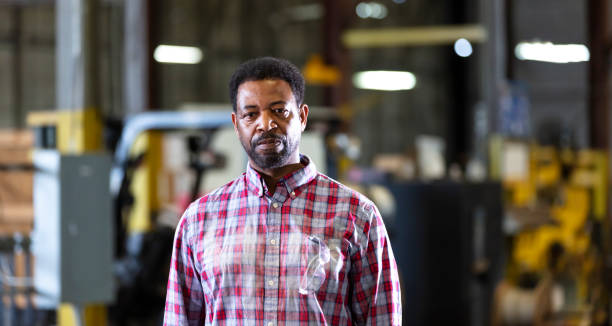 istock African-American man working in warehouse 1364682127