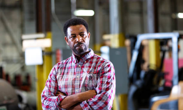 istock African-American man working in warehouse 1364682130