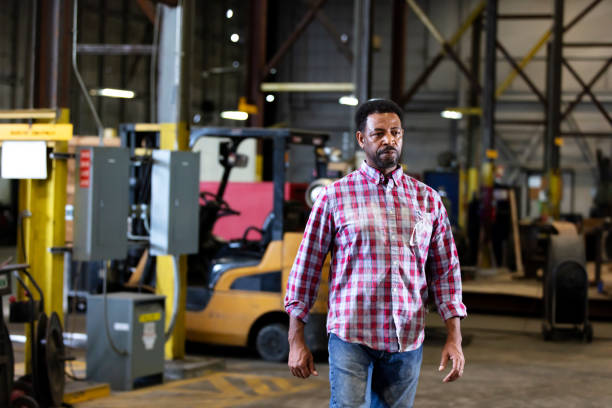 istock African-American man walking thru warehouse 1364682192