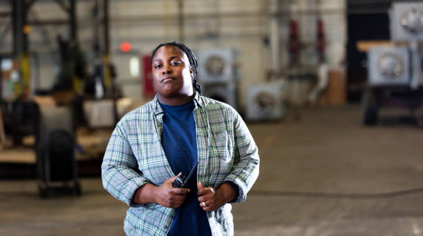 istock African-American woman working in warehouse 1364682271