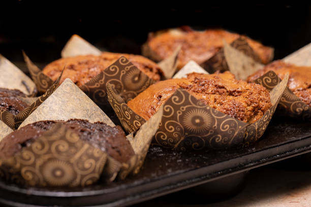 istock Chocolate and vanilla muffins wrapped in decorative wrapper from a local coffee shop 1364682274
