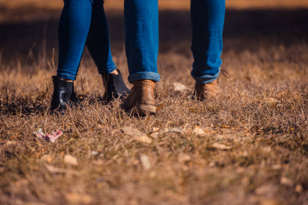 istock Splendid couple standing close in the park 1364685558
