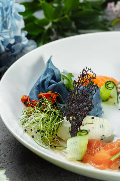 istock a stack of pancakes with salted salmon on a plate. Blue pancakes with salmon. Useful breakfast 1364692021