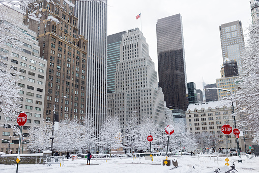 Midtown Manhattan street after huge snowfall in New York City.  Grand Army Plaza and Fifth avenue after New York Gets Its First Major Snow storm of the Season.