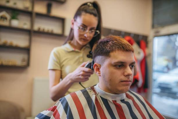 istock Young man having a haircut at a barbershop 1364708052