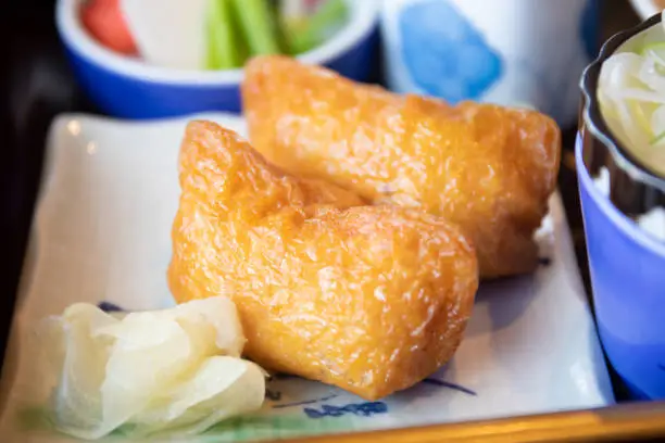 Known as Inarizushi in Japan, Inari Sushi is a type of traditional sushi made of vinegared rice tucked inside little deep-fried tofu pockets.