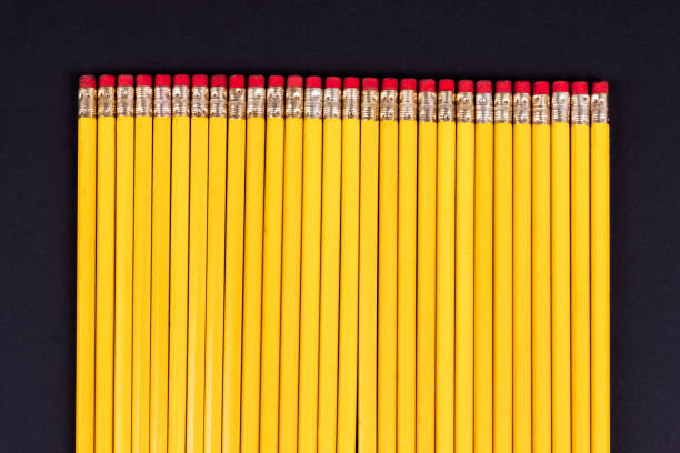 istock Top view on long even row of pencils with erasers 1364709786