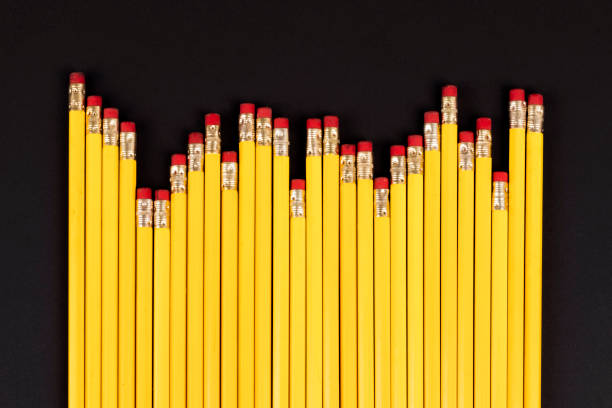 istock Long row of uneven pencils with erasers laying, representing candle graph 1364709789