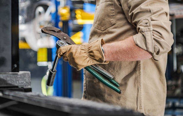 istock Automotive Industry Worker with Car Repairing Tools in His Hands 1364709834