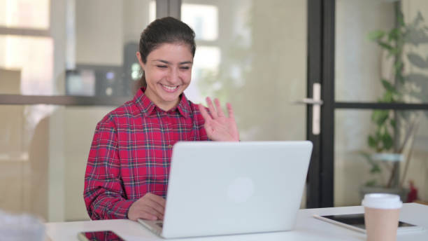 istock Indian Woman Talking on Video Call on Laptop 1364718248