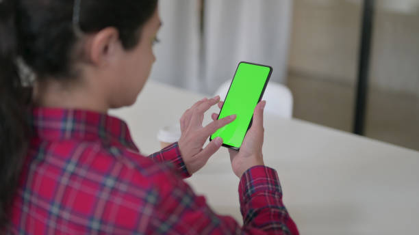 istock Indian Woman using Smartphone with Chroma Screen 1364718277