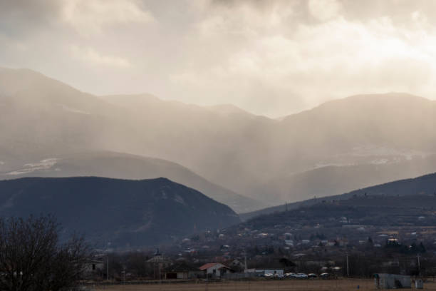 istock Mountain and town landscape during sunset 1364718473