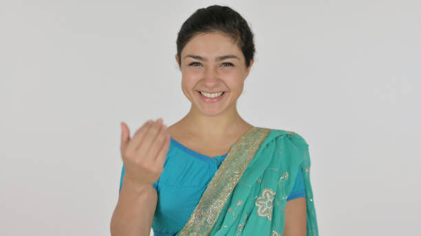 istock Indian Woman Pointing at the Camera and Inviting, White Background 1364720151