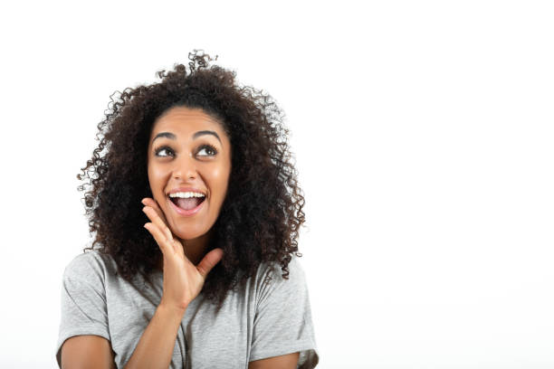 istock Positive young woman looking up 1364720960