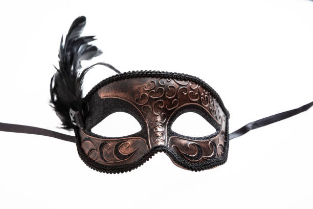 istock Carnival mask brown color with black feather decoration isolated on white background, 1364722063